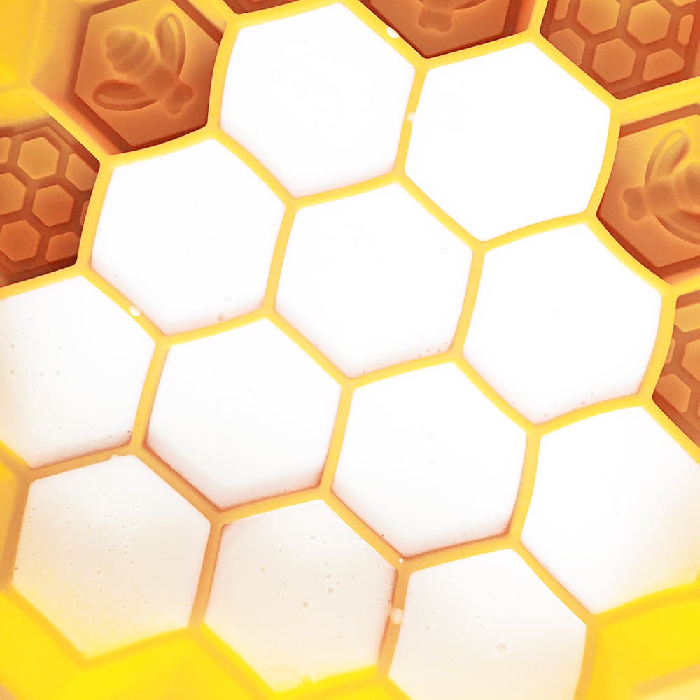 Diy honey goats milk soap mixture poured into a honeycomb mold to cool and harden