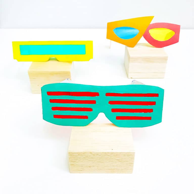 Kids will have a total blast crafting 3 pairs of bodacious 80's-inspired sunglasses out of an upcycled cereal box and paint! Free templates included.