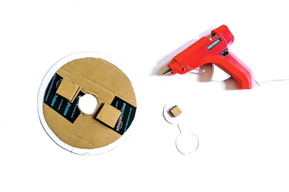 Glue cardboard spacers in between your rotating discs.