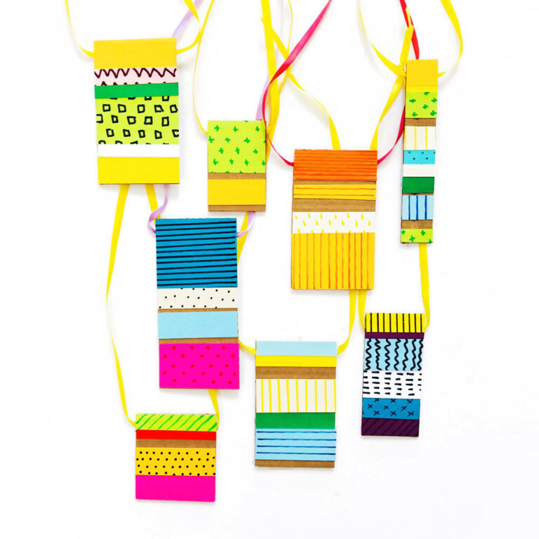 Upcycle an old box and some scrap paper into these super cool mix & match pattern DIY cardboard necklaces! An easy and relatively mess-free craft for kids. | via barley & birch