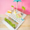 From just a few scraps of wood and simple supplies, you can make your own super-hip, mid-century-modern beachfront DIY dollhouse in an afternoon. No, seriously!