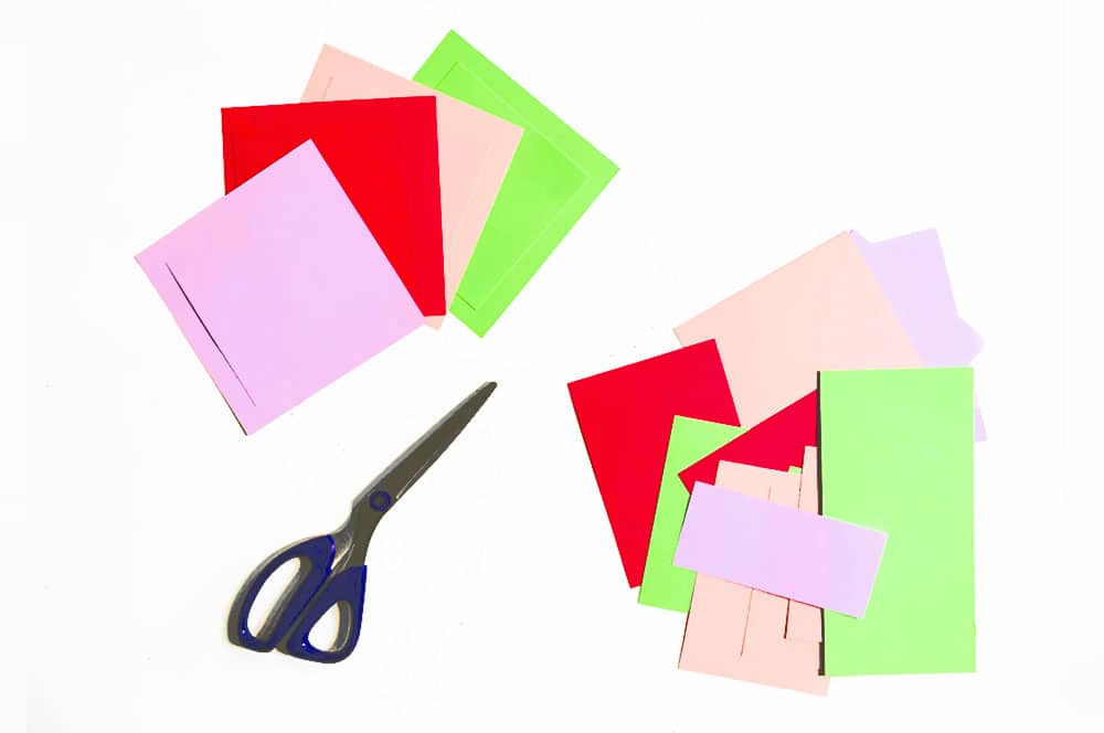 Cut squares of paper to use as colorful backgrounds for your flowers