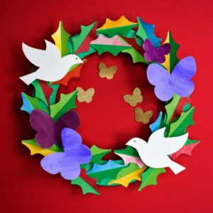 A DIY peace and love paper wreath. Use watercolor washes on our free templates to create this lovely handmade holiday keepsake. | via barley & birch