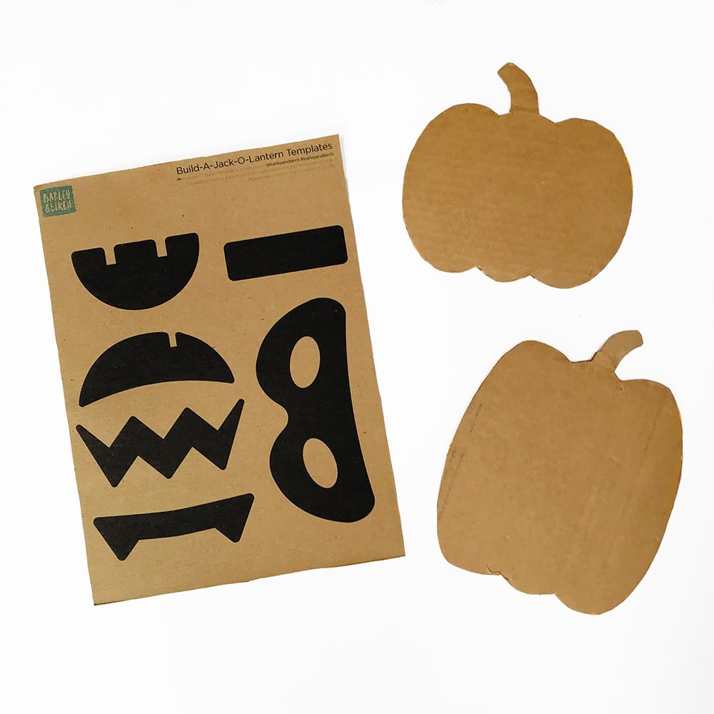 Cardboard pumpkins for a build-your-own-jack-o-lantern Halloween play activity for kids