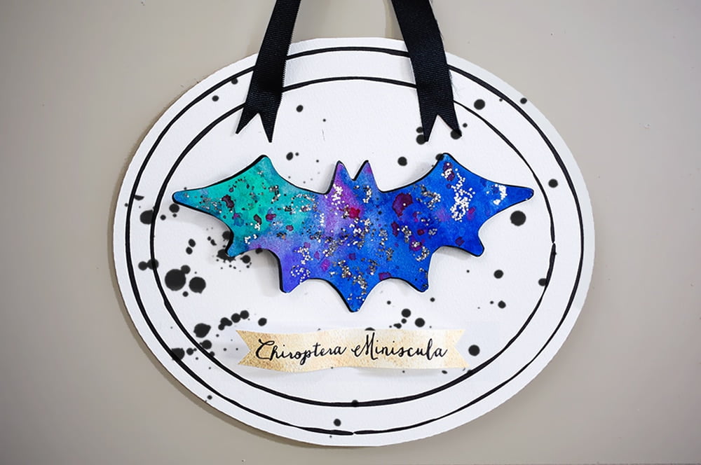 Add your bat and a name label, then hang your framed bat | DIY faux bat collection for kids