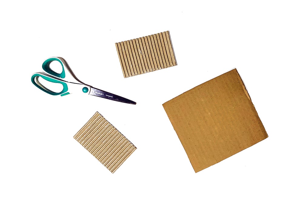 Cut roof pieces and a large square for the bottom from scrap cardboard