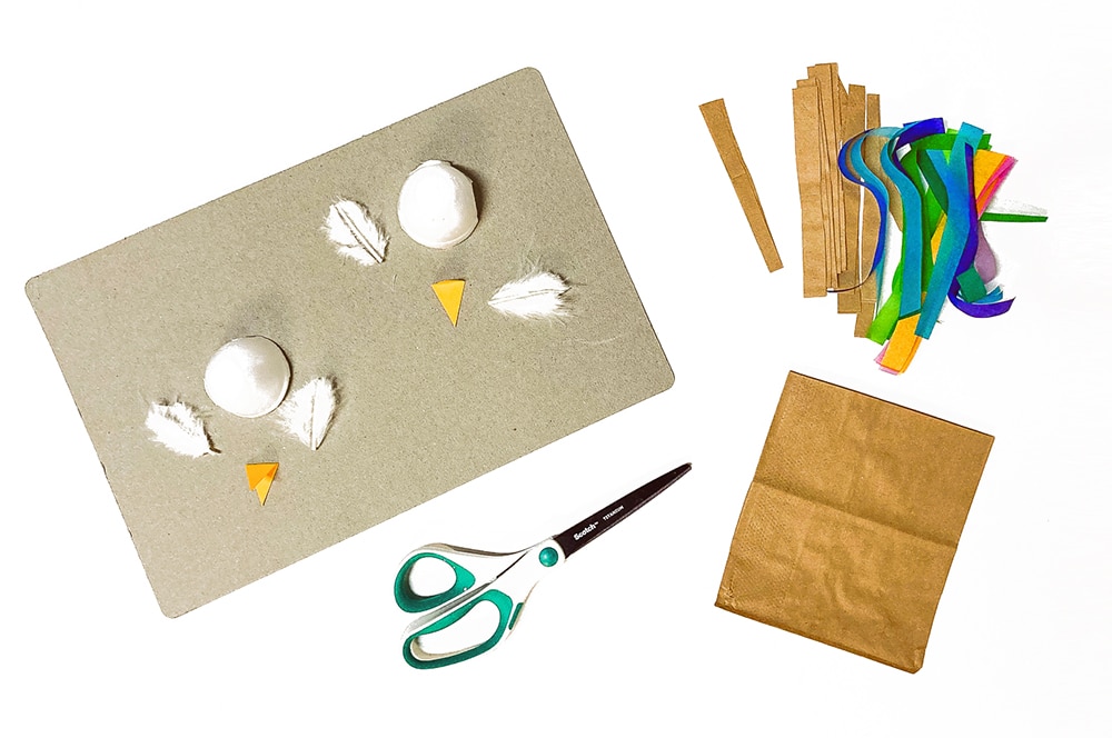 Use a paper bag and egg carton cups to make your bird nest and baby birds