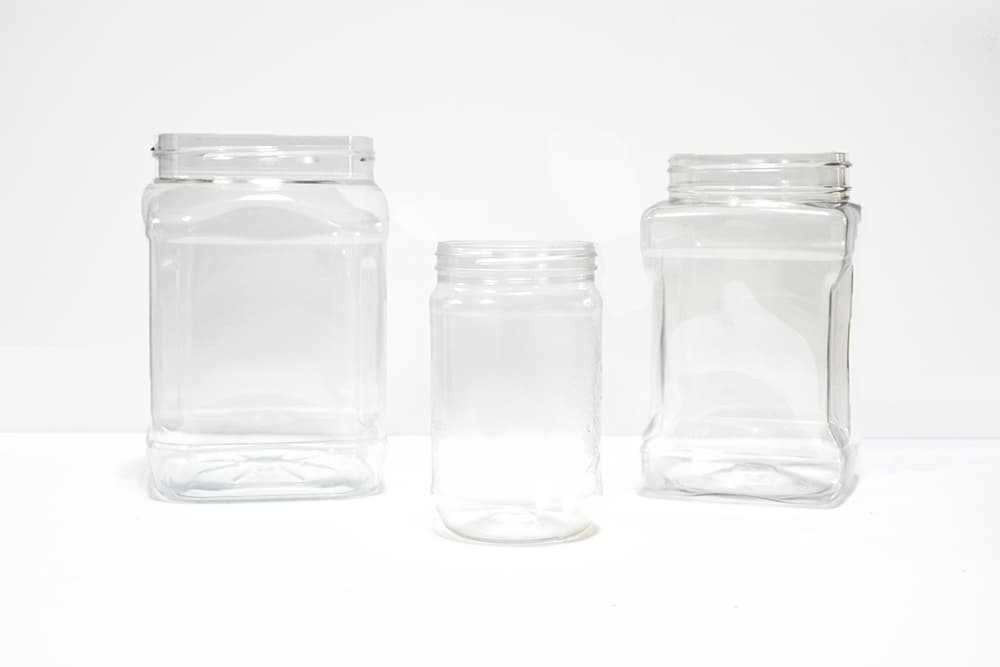 Gather plastic containers to clean and reuse for your DIY trick-or-treat pails.