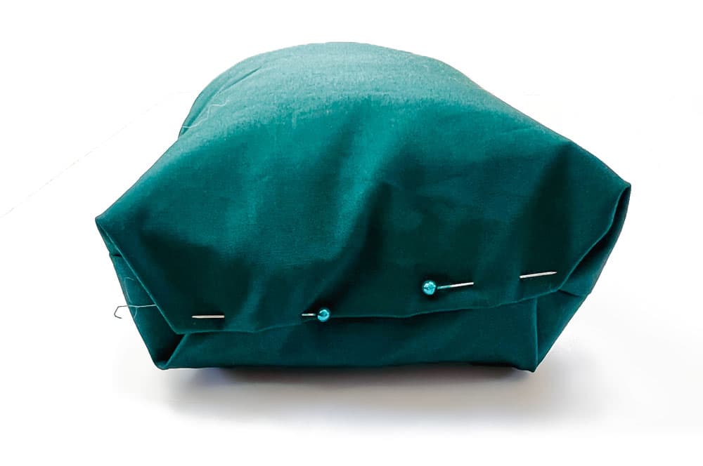Fold and pin the bottom of your soft houses closed then sew shut.