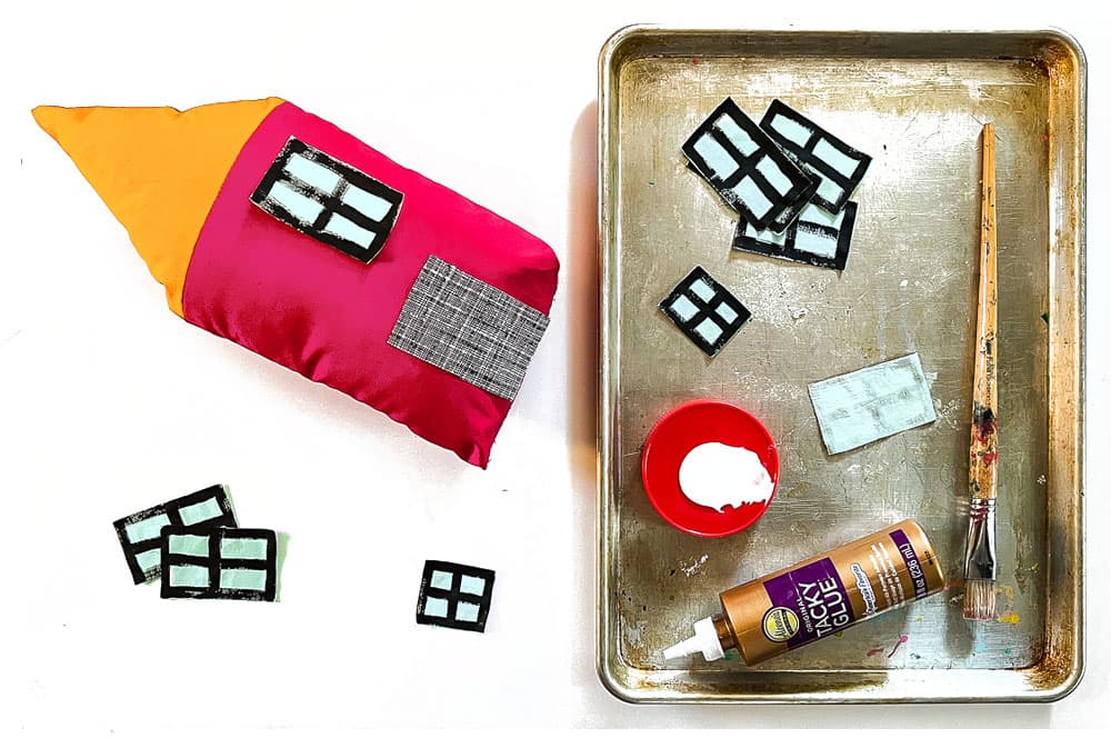 Glue the windows and doors to your soft houses.