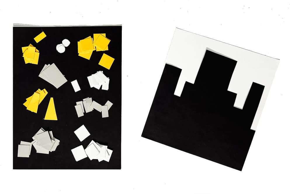 Our city skyline and construction paper pieces sitting on a white background.