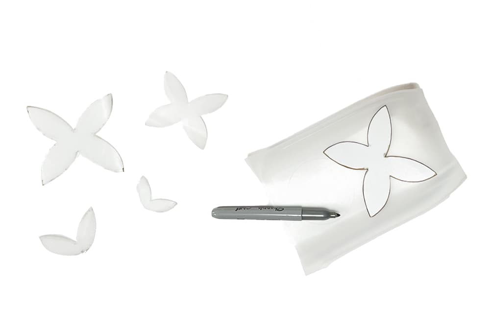 Sets of fairy wings cut out from a plastic gallon water jug