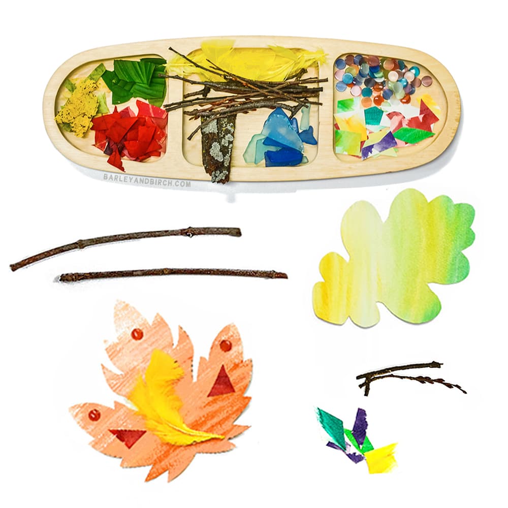 paper leaves and loose parts play items sitting in a tray on a white background