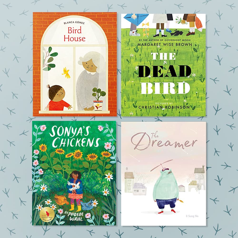 Four childrens books about birds and loss or hardships sitting on a blue patterned background