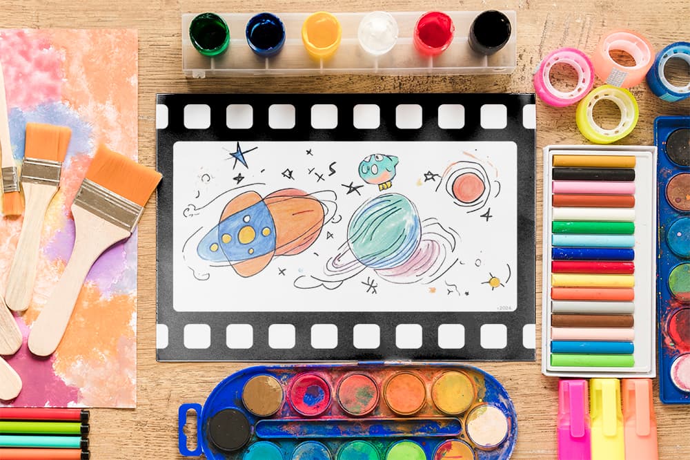 Movie-themed art prompt for kids sitting on a table with art supplies