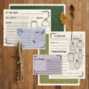 Our printable potion and spell recipe card art prompts for kids sitting on a wooden table with fall nature items