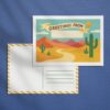 Illustrated DIY postcard for kids featuring a desert landscape. The front includes a “Greetings From” banner with space to write a location. The back shows a traditional postcard layout with an address area and striped border.