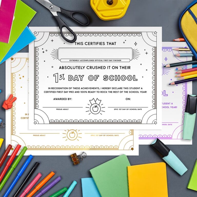 Our free printable first day of school award certificates sitting on gray paper surrounded by school supplies