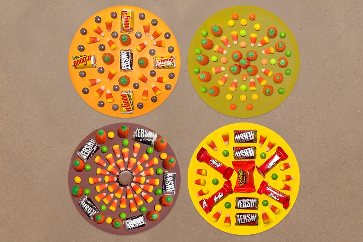 Four candy mandalas sitting on a Kraft paper background