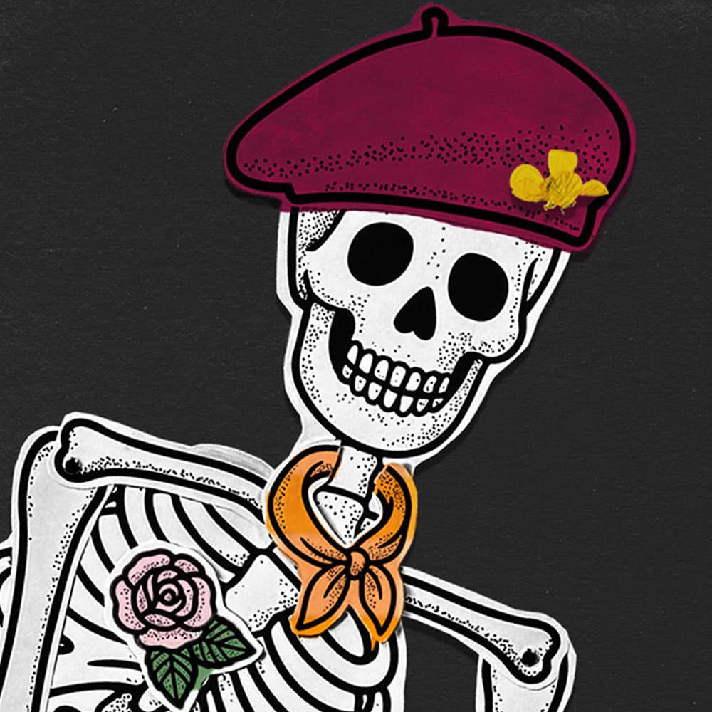 A life-sized paper skeleton decorated with paper accessories sitting on a black background